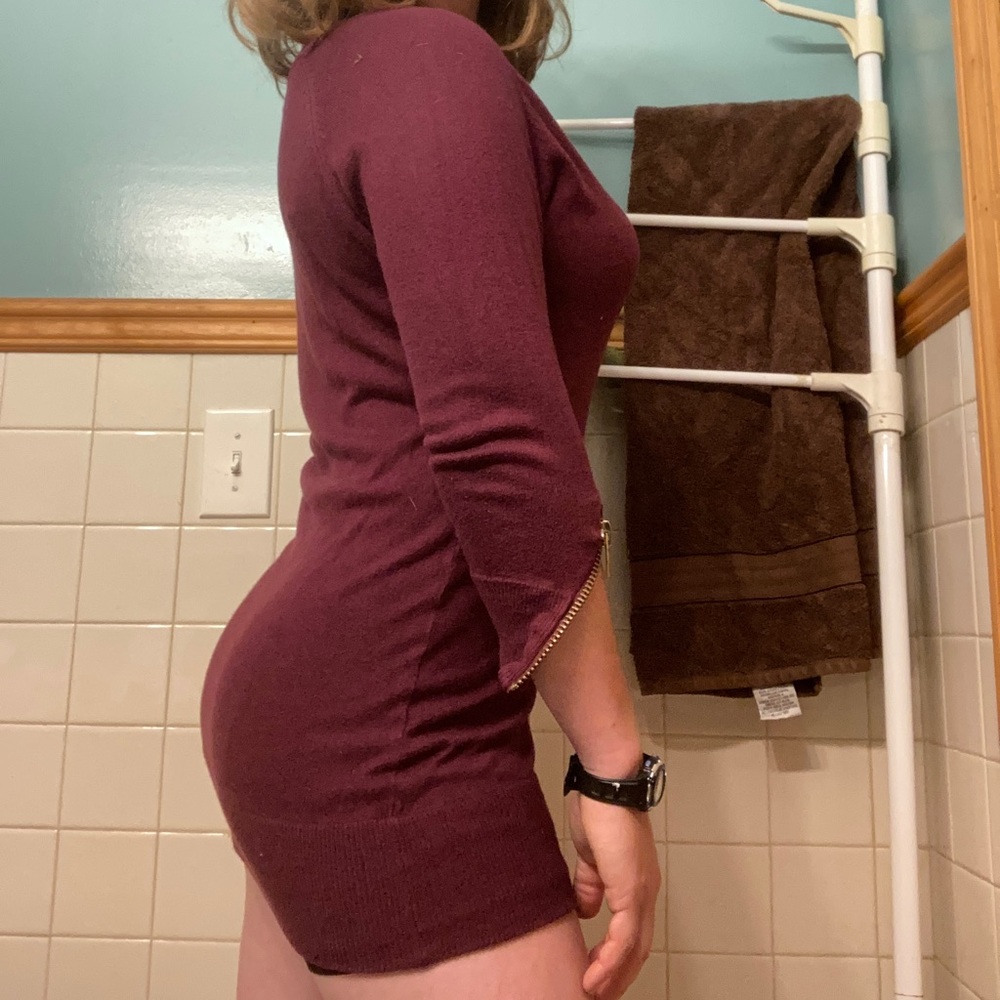 Really cute maroon sweater dress with gold zippers on sleeve